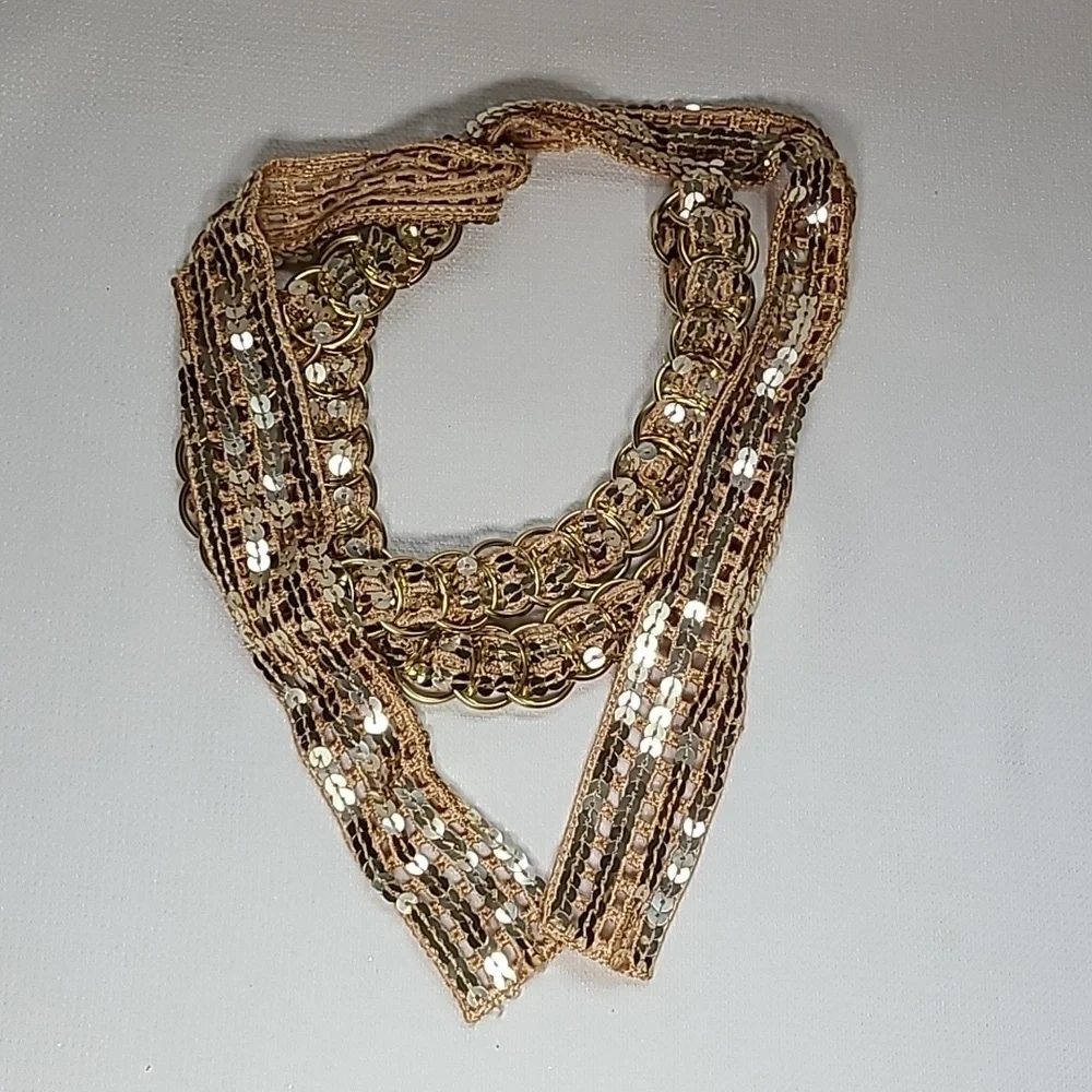 Vintage belt, gold rings, open weave fabric, sequins galore!  Glam!!